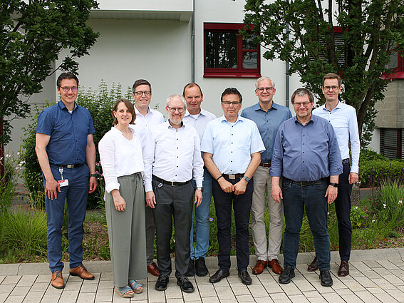The joint steering committee of TH OWL and the Weidmüller Group stands in front of the TH OWL administration building on the Innovation Campus Lemgo; from left: Professor Dr. Henning Trsek (Chairman of the Board, Institute for Industrial IT), Anja Moldehn (Executive Board & Technology Management, CIIT e.V.), Dr. Timo Berger (CTO, Weidmüller), Professor Dr. Holger Borcherding (Executive Board Member, Research institute Future Energy), Professor Dr. Jürgen Krahl (President of TH OWL), Professor Dr. Jürgen Jasperneite (Director, Fraunhofer IOSB-INA), Dr. Sebastian Durst (CEO of Weidmüller), Professor Dr. Stefan Witte (Vice-President for Research and Transfer at TH OWL), Dr. Jan-Stefan Michels (Head of Standards and Technology Development at Weidmüller)