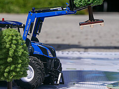 The future grows here! - A tree is planted on the campus map with a mini tractor!
