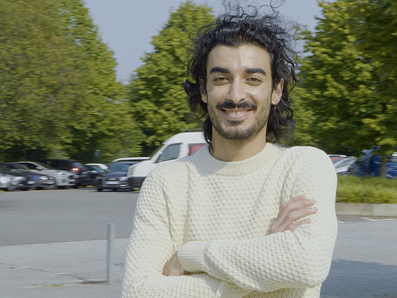 young man on the street, looking at the camera