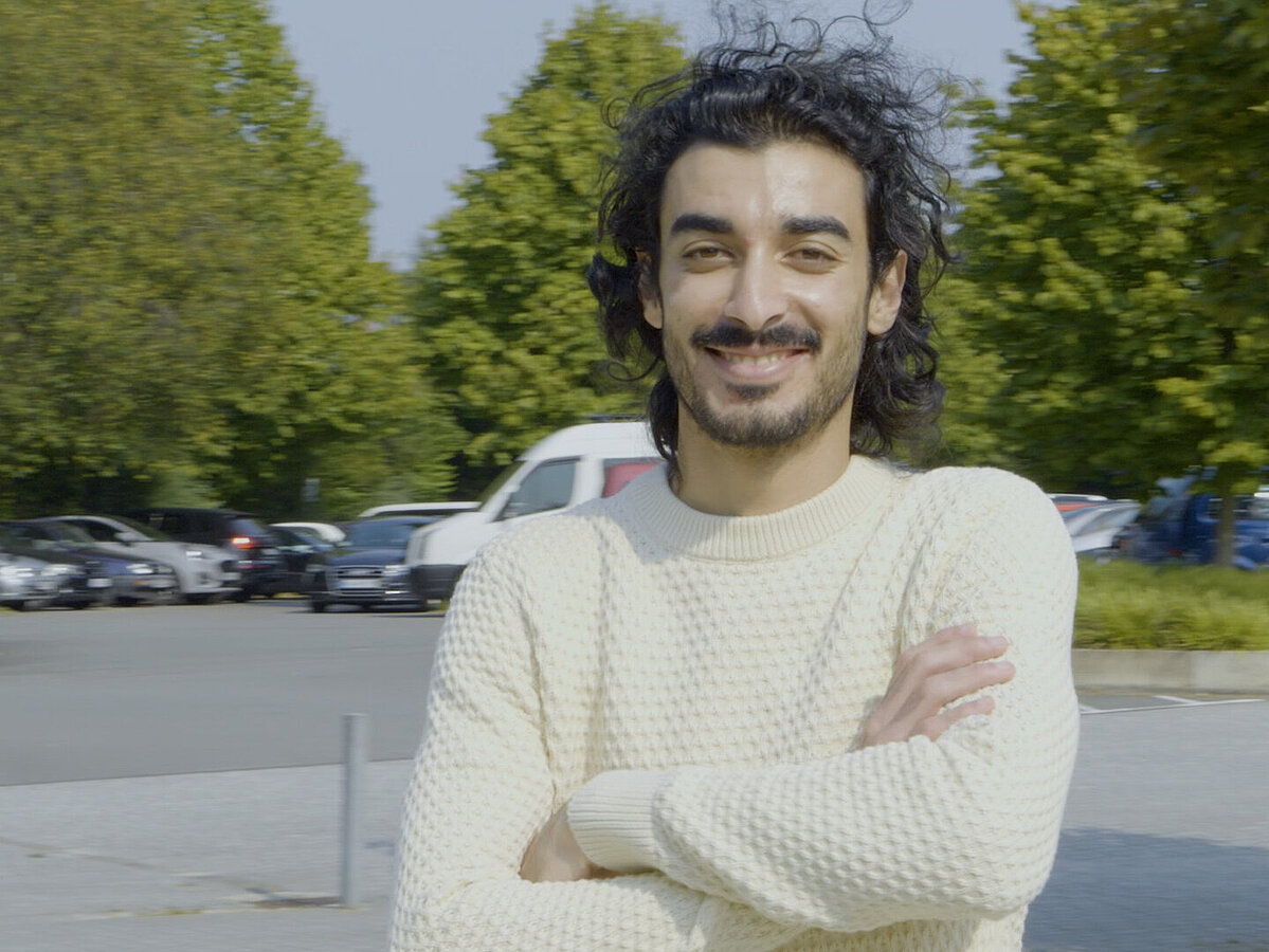 young man on the street, looking at the camera