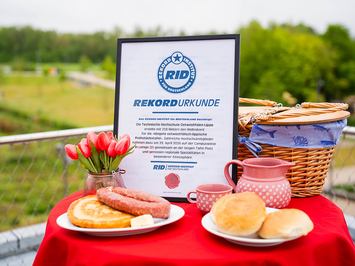 A breakfast table set with a certificate.
