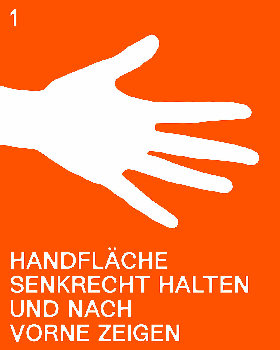 1. Schritt des Stillen Hilferufs: Handfläche senkrecht halten und nach vorne zeigen